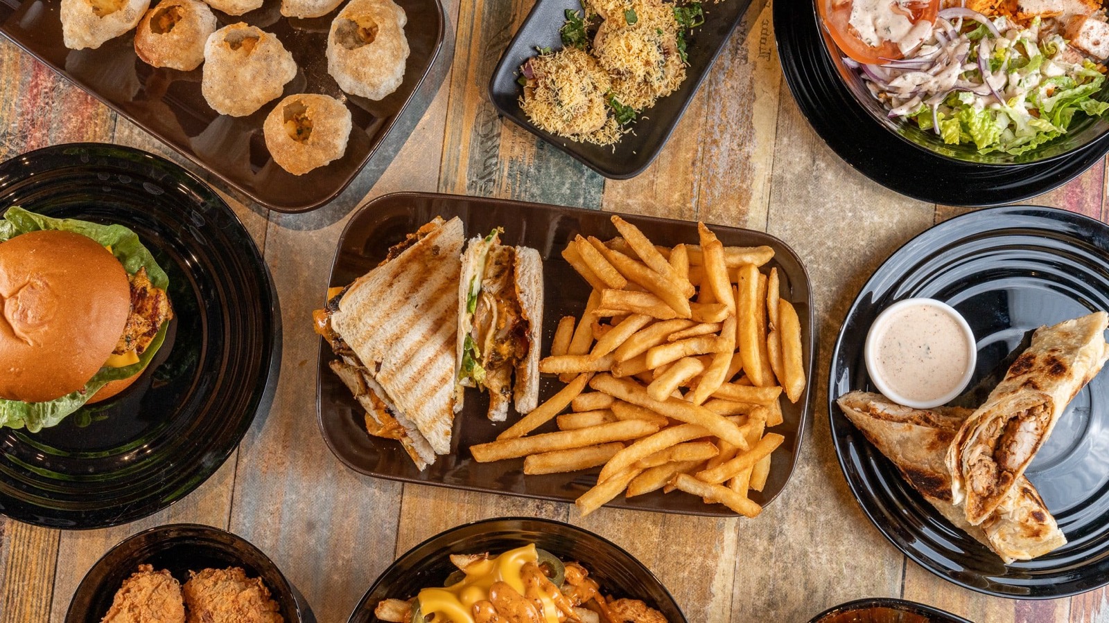 Overhead spread of restaurant dishes